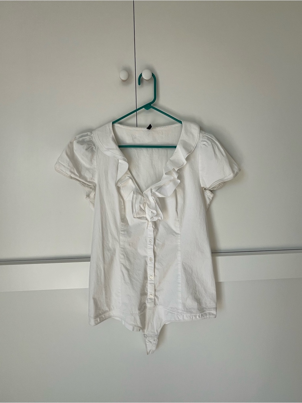 White Ruffle Front Button Women's body suit